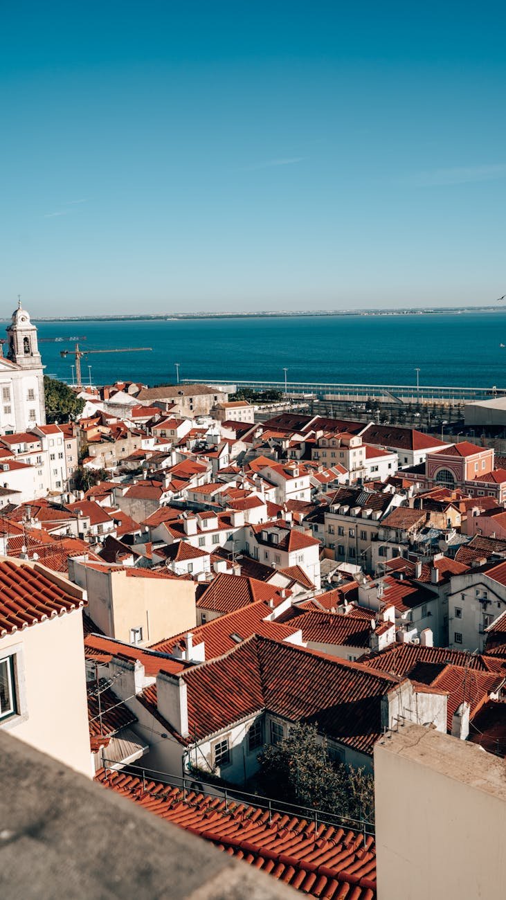 scenic view of lisbon s red rooftops and ocean